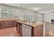 Kitchen island with granite countertop and stainless steel dishwasher at 1354 Slate Bend Dr, Dacula, GA 30019