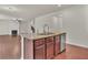 Island kitchen with granite countertops and stainless steel appliances at 1354 Slate Bend Dr, Dacula, GA 30019