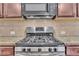 Stainless steel gas cooktop in a modern kitchen at 1354 Slate Bend Dr, Dacula, GA 30019