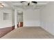 Spacious living area with hardwood floors, neutral walls, and a view to the foyer at 1354 Slate Bend Dr, Dacula, GA 30019