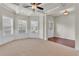 Bright living room with hardwood floors, neutral walls, and wainscoting at 1354 Slate Bend Dr, Dacula, GA 30019
