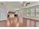 Spacious living area with hardwood floors, large windows, and access to kitchen at 1354 Slate Bend Dr, Dacula, GA 30019
