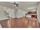 Open floor plan living room with hardwood floors and kitchen view at 1354 Slate Bend Dr, Dacula, GA 30019