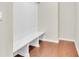 Mudroom with built-in bench and white beadboard at 1354 Slate Bend Dr, Dacula, GA 30019