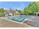 Community pool with lounge chairs and clubhouse at 1354 Slate Bend Dr, Dacula, GA 30019