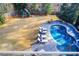 Aerial view of backyard featuring a pool, lounge chairs, a playset, and a lawn at 171 Johnson Ferry Nw Rd, Atlanta, GA 30328