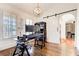 Home office with a barn door, hardwood floors, and ample workspace at 171 Johnson Ferry Nw Rd, Atlanta, GA 30328