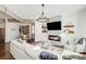 Spacious living room featuring a fireplace, built-in shelving, and hardwood floors at 171 Johnson Ferry Nw Rd, Atlanta, GA 30328