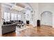 Bright living room with coffered ceiling, large windows, fireplace, and built-in shelving at 171 Johnson Ferry Nw Rd, Atlanta, GA 30328