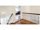 Upper hallway with hardwood floors and view of a sitting area at 171 Johnson Ferry Nw Rd, Atlanta, GA 30328