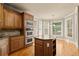 Kitchen with island, granite counters and bay window at 3258 Aberrone Pl, Buford, GA 30519