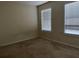 Spacious bedroom with neutral walls and carpet at 74 Windsor Way, Riverdale, GA 30274