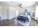 Spacious bedroom with hardwood floors, a ceiling fan, and large windows at 165 Mayson Ne Ave # A, Atlanta, GA 30307