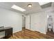 Finished basement with vinyl flooring, modern lighting, and ample space at 2947 Dunnington Cir, Chamblee, GA 30341