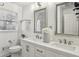 Bright bathroom with double sinks, white cabinets, and modern fixtures at 2947 Dunnington Cir, Chamblee, GA 30341