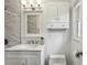Bright bathroom with white vanity, marble countertop, and sleek fixtures and hardware at 2947 Dunnington Cir, Chamblee, GA 30341