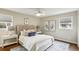 Calm bedroom featuring neutral walls, a plush bed, bedside tables, and lots of natural light at 2947 Dunnington Cir, Chamblee, GA 30341