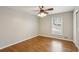This bedroom features beautiful hardwood floors and a ceiling fan with a light at 2947 Dunnington Cir, Chamblee, GA 30341