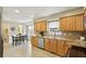 Functional kitchen featuring wood cabinets, granite countertops, stainless steel appliances, and tile flooring at 2947 Dunnington Cir, Chamblee, GA 30341
