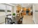 Bright eat-in kitchen with wooden cabinets, stainless steel appliances, tile flooring, and large windows at 2947 Dunnington Cir, Chamblee, GA 30341
