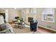 Stylish living room with a white-painted brick fireplace, hardwood floors, modern furniture, and ample natural light at 2947 Dunnington Cir, Chamblee, GA 30341