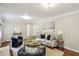 Elegant living room showcasing hardwood floors, neutral tones, fireplace, and comfortable seating at 2947 Dunnington Cir, Chamblee, GA 30341