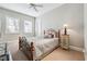 Bedroom featuring carpet, ceiling fan and a window at 3970 Bridgeman Cir, Cumming, GA 30041