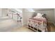 Loft bedroom featuring cozy nautical themed bed with lookout to lower level at 3970 Bridgeman Cir, Cumming, GA 30041