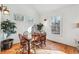 Dining area with natural light, wood floors, and views of nature through the windows at 3970 Bridgeman Cir, Cumming, GA 30041