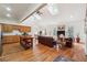 Open-concept living room featuring hardwood floors, skylights, and comfortable seating at 3970 Bridgeman Cir, Cumming, GA 30041