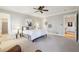 Spacious carpeted main bedroom featuring neutral paint and a stylish ensuite bathroom at 3970 Bridgeman Cir, Cumming, GA 30041