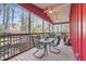 Inviting screened porch with seating, ceiling fans, and wooded views for relaxed outdoor living at 3970 Bridgeman Cir, Cumming, GA 30041
