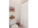 Cozy toilet room with a shower curtain, toilet and art at 3970 Bridgeman Cir, Cumming, GA 30041