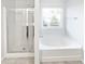 Bathroom with shower and bathtub at 5823 Keystone Pt, Lithonia, GA 30058