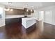 Kitchen with island and dark brown cabinets at 5823 Keystone Pt, Lithonia, GA 30058