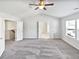 Spacious main bedroom with carpet and ceiling fan at 5823 Keystone Pt, Lithonia, GA 30058