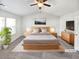 Virtually staged main bedroom with high ceilings and neutral decor at 5823 Keystone Pt, Lithonia, GA 30058