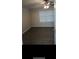 Spacious bedroom with ceiling fan and wood-look floors at 6101 Waldrop Pl, Decatur, GA 30034