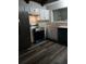 Kitchen with white cabinets and stainless steel appliances at 6101 Waldrop Pl, Decatur, GA 30034