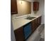 Kitchen with light countertops, wood cabinets, and dishwasher at 6101 Waldrop Pl, Decatur, GA 30034