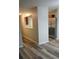 Open living room with wood-look floors and access to kitchen at 6101 Waldrop Pl, Decatur, GA 30034