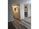 Open living room with wood-look floors and access to kitchen at 6101 Waldrop Pl, Decatur, GA 30034