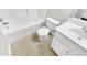 Clean bathroom with a white tub, toilet, and vanity at 508 Kensington Park Dr, Canton, GA 30114