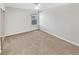 Second bedroom with carpet and window at 508 Kensington Park Dr, Canton, GA 30114