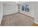Bright dining room with neutral walls and carpet at 508 Kensington Park Dr, Canton, GA 30114