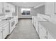 Modern kitchen featuring white cabinets and appliances at 508 Kensington Park Dr, Canton, GA 30114
