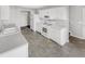 Kitchen with white cabinets, white appliances and light grey countertops at 508 Kensington Park Dr, Canton, GA 30114