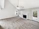 Spacious living room featuring vaulted ceilings, fireplace and neutral carpeting at 508 Kensington Park Dr, Canton, GA 30114