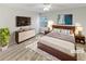 Virtually staged main bedroom with a king-size bed, dresser and nightstands at 508 Kensington Park Dr, Canton, GA 30114