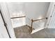 Upstairs hall with carpeted stairs and railing at 508 Kensington Park Dr, Canton, GA 30114